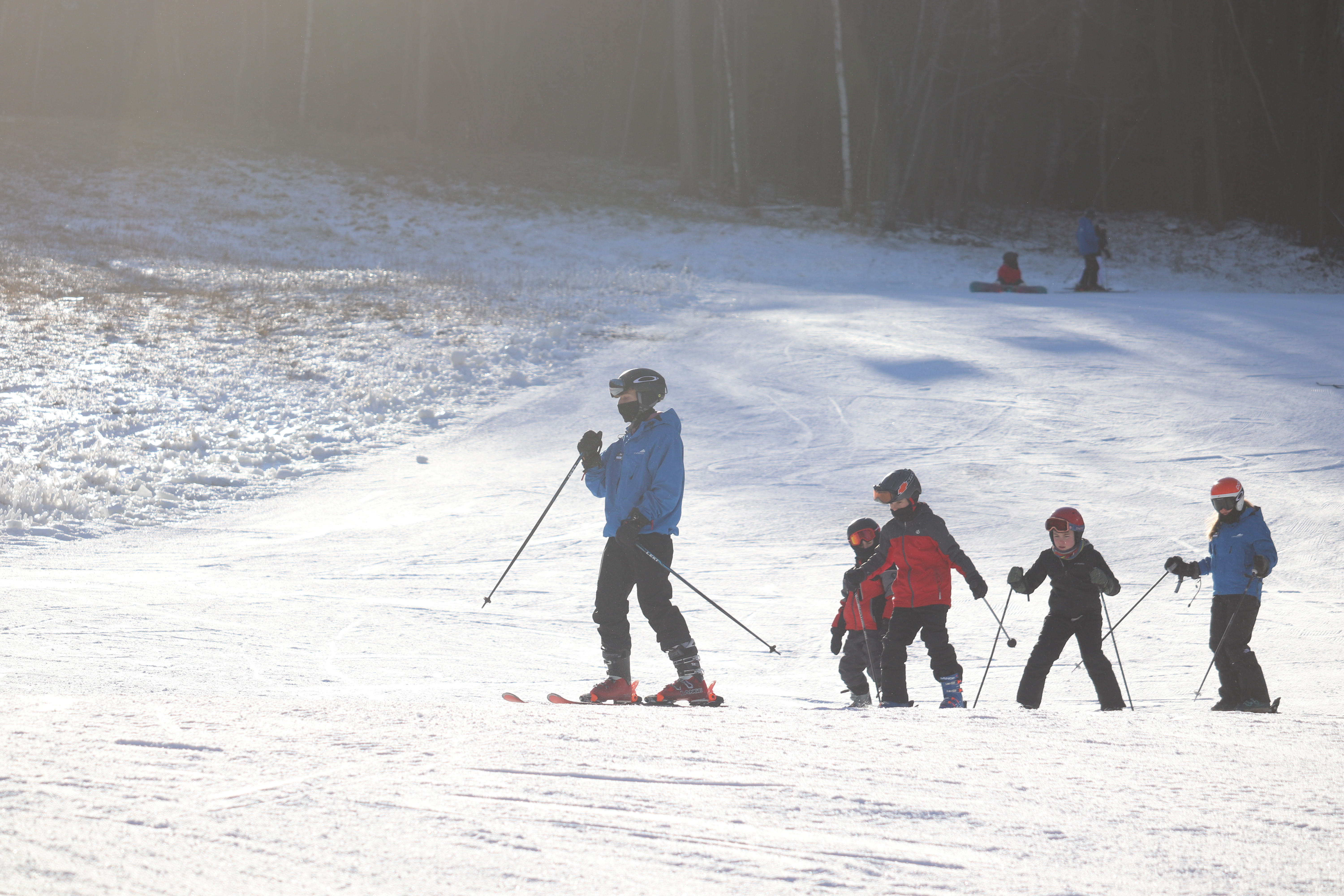 A ski instructor leading a group of young skiers at Catamount Ski Resort